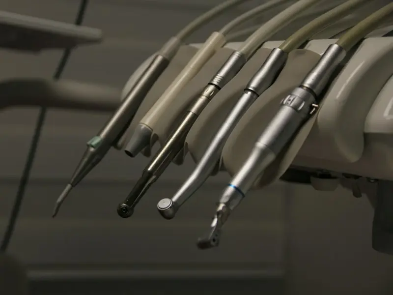 Dental handpieces lined up on their holder